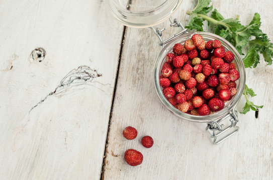 Wild strawberry in glass jar