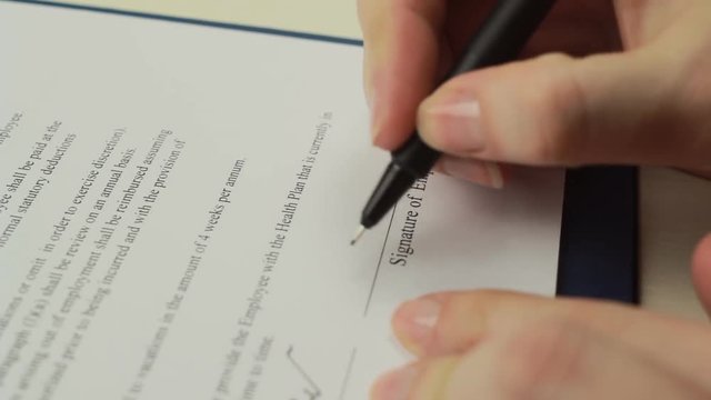 Woman signing employment agreement, close up