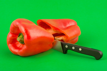 red pepper on a green background