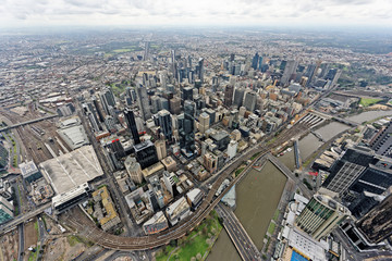 Fototapeta na wymiar Aerial view over Melbourne CBD under overcast skies (Victoria, Australia)