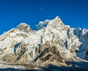 The Moon, mount Everest (8848 m), and Nuptse (7864 m) in the evening (view from Kala Patthar) -...