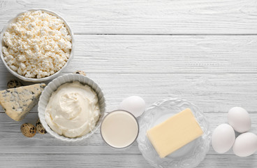 Different dairy products on wooden table