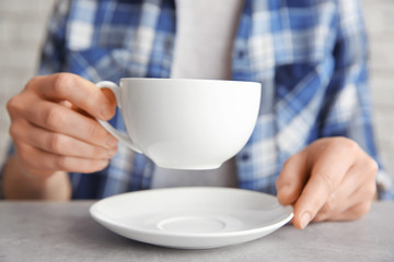 Closeup view of woman with blank cup