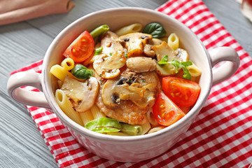 Tasty chicken marsala with vegetables on table