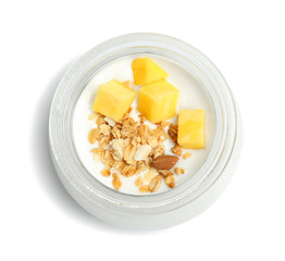 Delicious dessert with mango in jar on white background