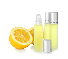 Perfume bottles and lemon on white background