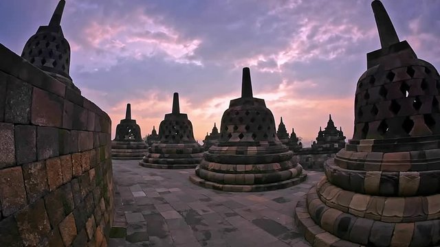 Sunrise over Borobudur temple. Beautiful Buddhist sculptures and ancient carving. Sightseeing and traveling in Java Indonesia