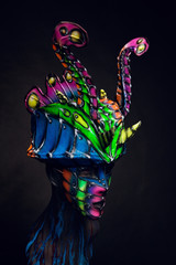 Mannequin girl in airbrush mask and headwear