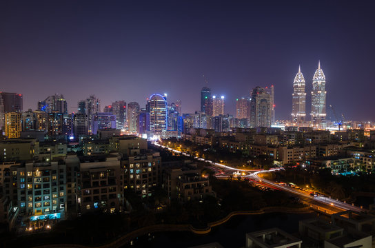 dubai, united arab emirates, 05/05/2016 tecom dubai business towers at night lit up, tecom dubai, uae.