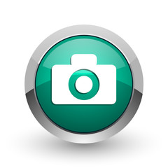 Camera silver metallic chrome web design green round internet icon with shadow on white background.