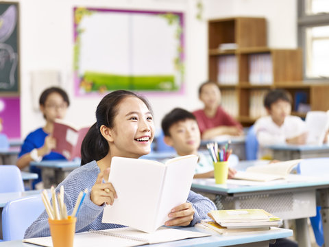 asian primary school girl smiling in class