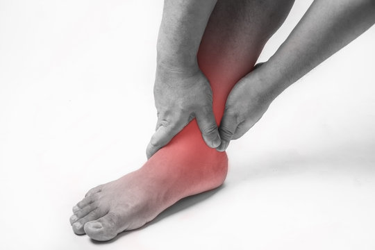 ankle injury in humans .ankle pain,joint pains people medical, mono tone highlight at ankle