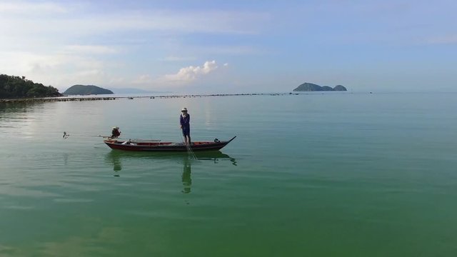 Aerial: Fisherman on Fishing Boat in Sea