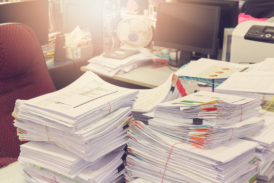Business Concept, Pile of unfinished documents on office desk, Stack of business paper, Vintage Effect