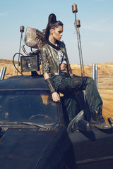 Woman in brutal style clothes and car 