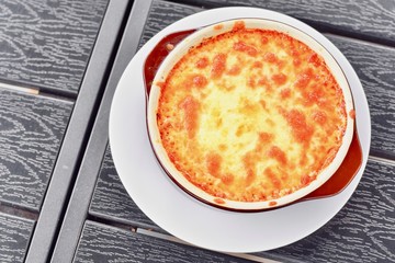 Freshly Baked Pork Lasagna on a Wooden Table