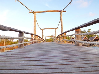 The wooden bridge  with sunny blue sky as background