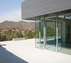 External view of a contemporary house with pool at dusk