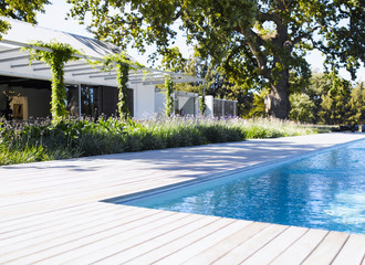 External view of a contemporary house with pool at dusk