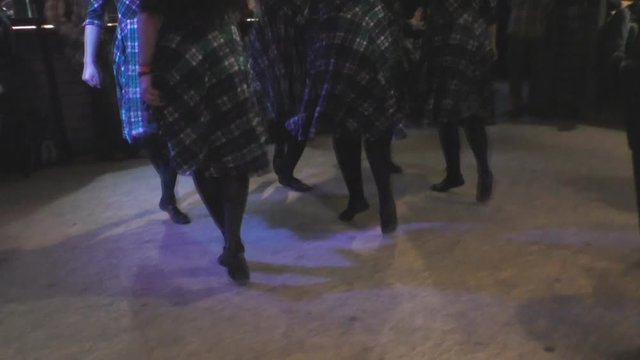 group of girls perform professionally Irish folk dance