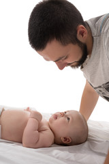 Bearded young dad with newborn in studio