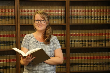 Young woman lawyer in law library