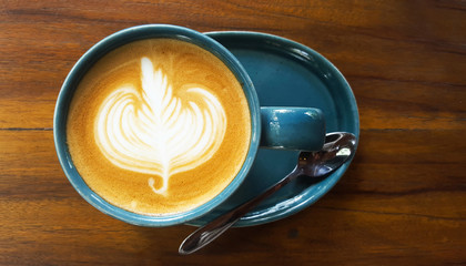 Cup of latte coffee on table