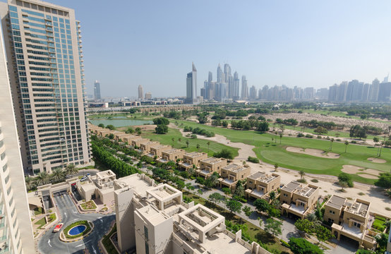 dubai, united arab emirates, 05/05/2016, the greens dubai home and apartment complex showing media city and dubai marina buildings.