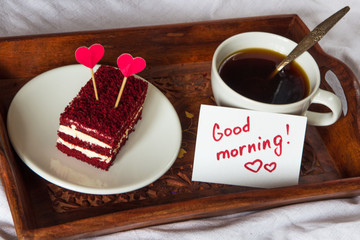Breakfast in bed. Cup, coffee, red, velvet, cake and note with text Good morning
