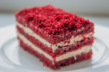 red velvet slice of cake on white plate