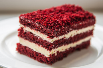 red velvet slice of cake on white plate