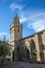 Fototapeta na wymiar Southern facade of the Church of Santa Maria, in Uncastillo, Zaragoza, Aragon, eastern Spain. It was built between 1135 and 1155 in Romanesque style