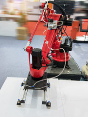 Robotic arm at production line in factory