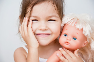 Asian girl with her doll 
