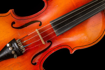 Fototapeta premium Old violin on a black background