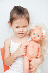 Little girl with a doll 