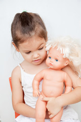 Little girl with a doll 