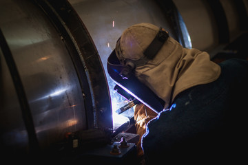 Welders working at the factory made meta