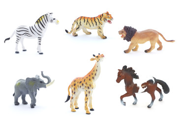 Collage of toy animals isolated on white background