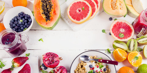Fresh fruits on  white wooden board. Healthy  eating concept.