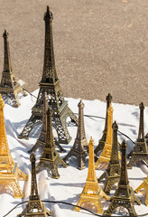 Souvenirs in the form of the Eiffel Tower on sale outside, Paris, France