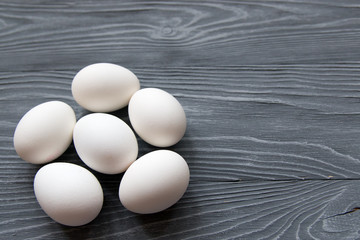 Chicken eggs on a gray background