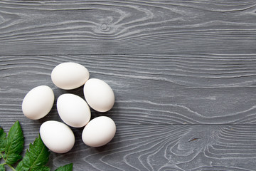 Chicken eggs on a gray background