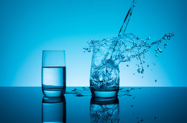 Сreative splashing water in the glass