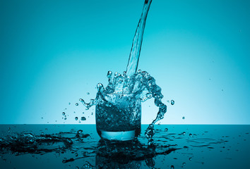 Сreative splashing water in the glass