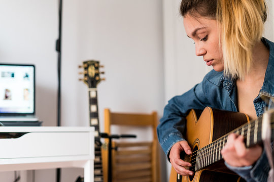 Young woman playing a guitar