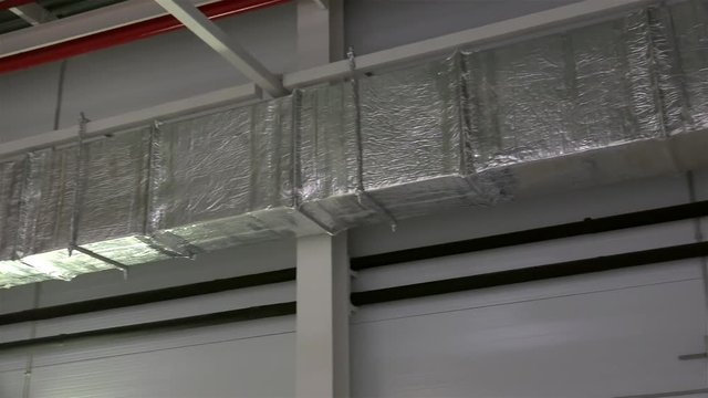 Air ducts for conditioning and ventilation & fire extinguishing pipes at an industrial facility.