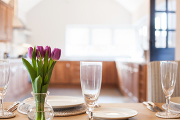 table setting with tulips in bright kitchen