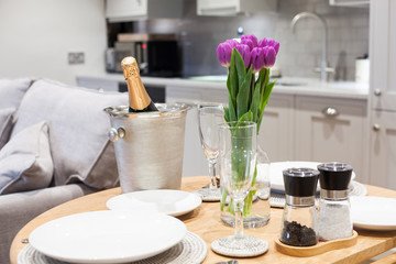 table setting with tulips in bright kitchen