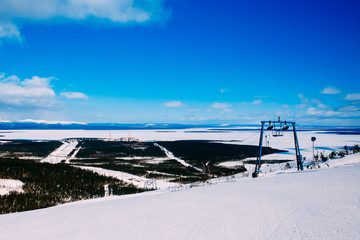 Kola NPP  nuclear power station from the mountain. Industrial landscape. In the background are the mountains of Khibiny and Imandra lake.